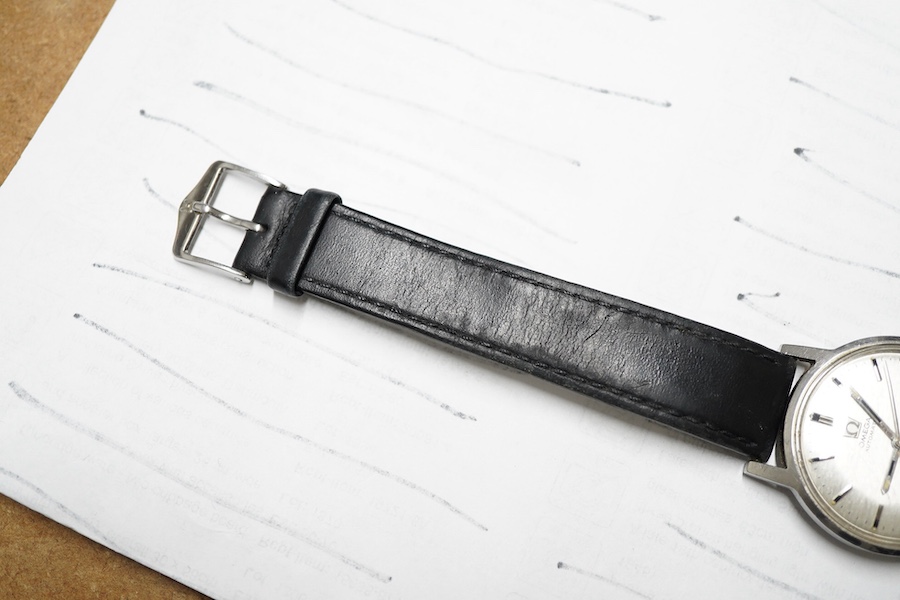 A gentleman's 1960's? stainless steel Omega Automatic wrist watch, with baton numerals and date aperture, case diameter 35mm, on an associated strap, no box or papers.